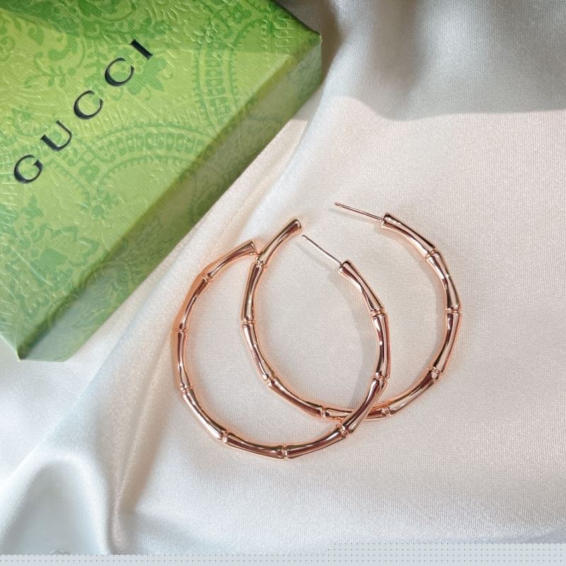 G*u*i earrings